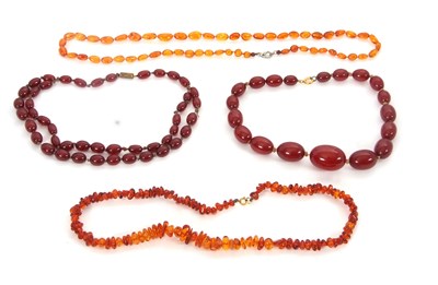 Lot 250 - A quantity of bakelite 'cherry amber' and...