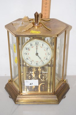 Lot 47 - A 20th Century brass cased tortion mantel...