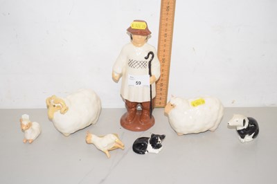 Lot 59 - A modern pottery shepherd with sheep and dogs