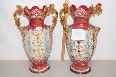 Lot 149 - A pair of large continental floral decorated...