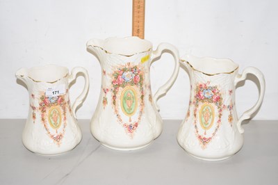 Lot 171 - Graduated set of Devon ware jugs