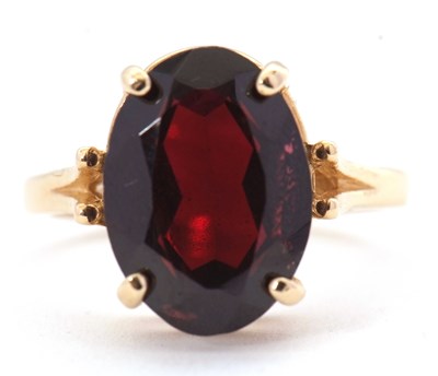 Lot 65 - A 14ct garnet ring, the oval mixed cut garnet,...