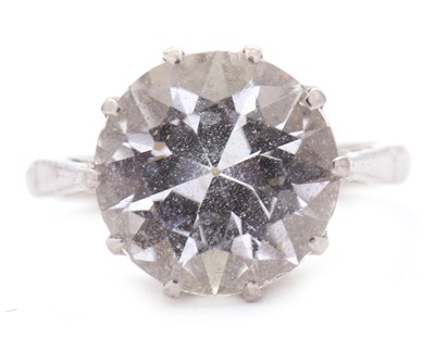 Lot 72 - A white topaz ring, the round modified...