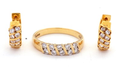 Lot 50 - An 18ct diamond ring and matching earrings,...