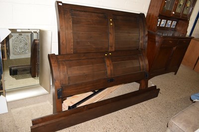 Lot 255 - A stained pine double bed frame