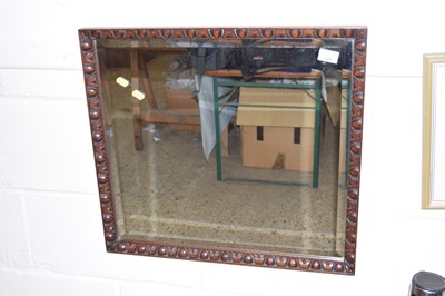 Lot 259 - A hardwood framed bevelled wall mirror