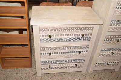 Lot 266 - A light wood three drawer chest with carved...