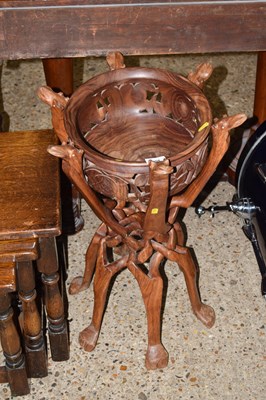 Lot 304 - A folding hardwood camel stand with bowl
