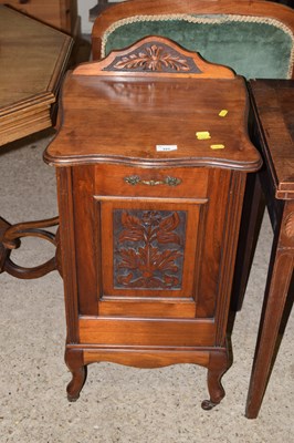 Lot 327 - A late Victorian American walnut coal perdonium