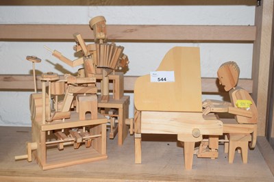 Lot 544 - Group of three wooden figures of musicians