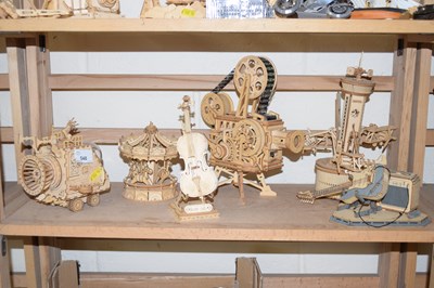 Lot 548 - A group of wooden construction toys to include...