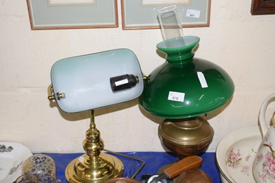 Lot 670 - A vintage oil lamp and a vintage bankers style...