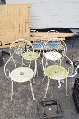 Lot 386 - A set of four metal garden chairs