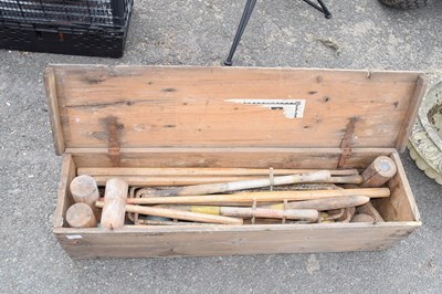 Lot 401 - A vintage croquet set in worn condition