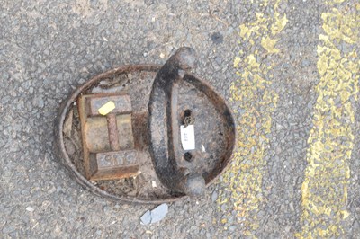 Lot 404 - A cast iron boot scraper and an iron weight