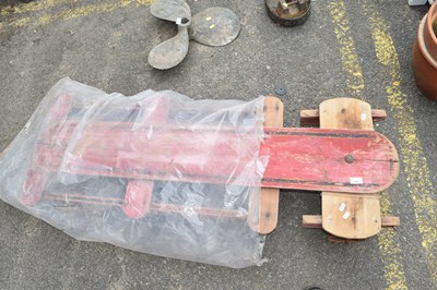 Lot 406 - A child's wooden pull along cart