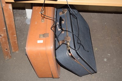 Lot 703 - Two suitcases including dolls