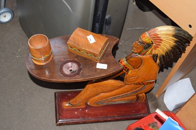 Lot 776 - A novelty carved wooden smokers table formed...