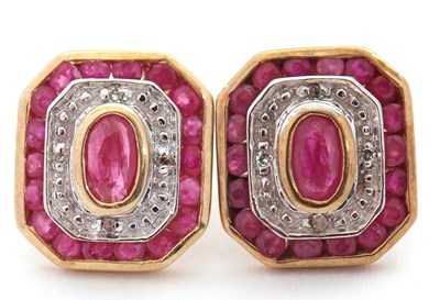 Lot 100 - A pair of 9ct ruby and diamond earrings, with...