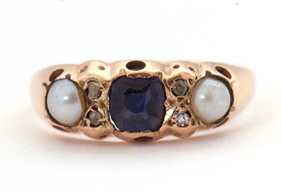 Lot 25 - A 9ct gemset ring, the central blue stone with...