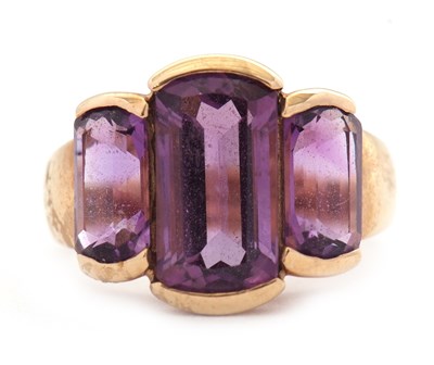Lot 61 - A 9ct amethyst ring, the three mixed cut...