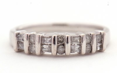 Lot 15 - A 14K diamond ring, alternatively set with two...