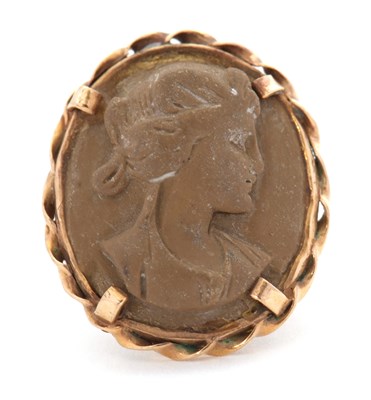 Lot 29 - A lava cameo ring, the oval lava cameo carved...
