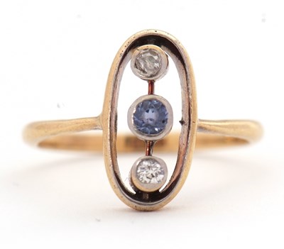 Lot 28 - A sapphire and diamond ring, the oval frame...