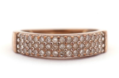 Lot 22 - A diamond ring, set with three rows of small...