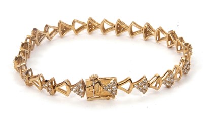 Lot 165 - A 9ct diamond bracelet, with triangular shape...
