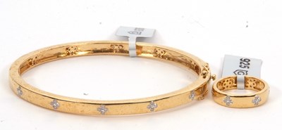 Lot 177 - A silver gilt diamond bangle and matching ring,...
