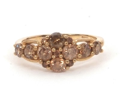 Lot 150 - A 9ct champagne diamond ring, set with round...