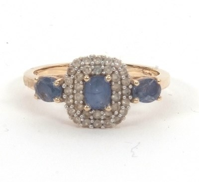 Lot 180 - A 9ct sapphire and white stone ring, the...