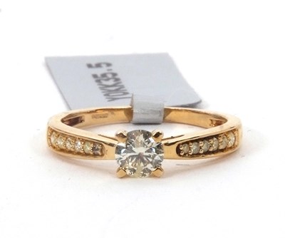 Lot 159 - A 9ct diamond ring, set with a central round...