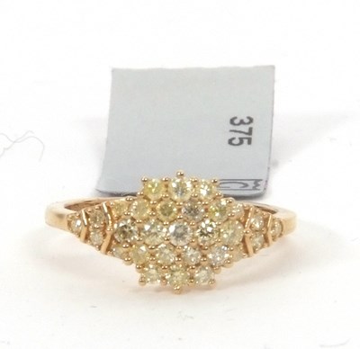Lot 153 - A 9ct yellow diamond ring, set throughout with...