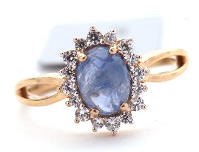 Lot 34 - A 9ct sapphire and white zircon ring, the...