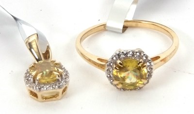 Lot 172 - A 9ct sphene and white zircon ring, the round...