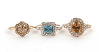 Lot 184 - Three gemset rings: to include a 9ct champagne...