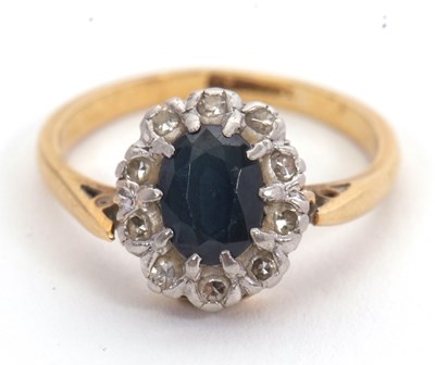 Lot 31 - A sapphire and diamond ring, the oval sapphire...
