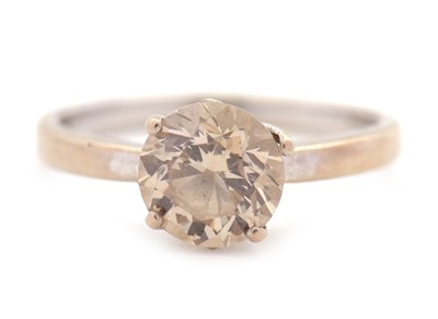 Lot 56 - An 18ct champagne diamond solitaire ring, the...