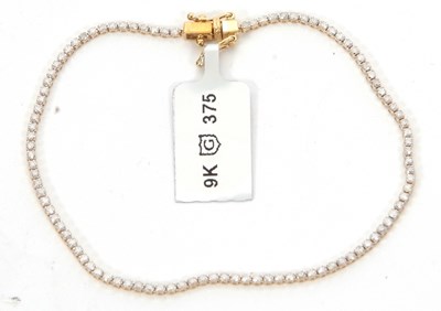 Lot 167 - A 9ct diamond bracelet, the round brilliant...
