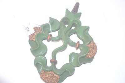 Lot 323 - A carved wooden emblem painted in green