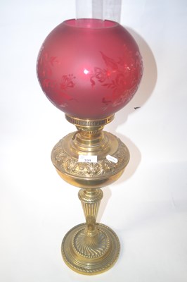 Lot 331 - A Victorian oil lamp with a brass column with...