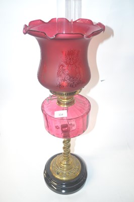 Lot 334 - Victorian oil lamp with cranberry glass...