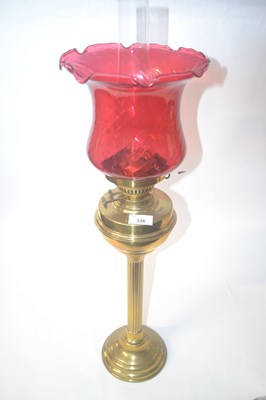 Lot 336 - Victorian oil lamp with cranberry glass shade...