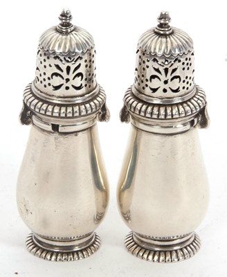 Lot 75 - A pair of antique white metal peppers of plain...