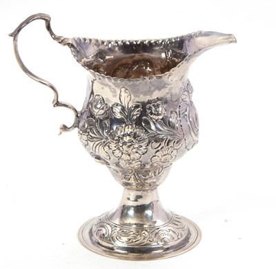 Lot 79 - A George III silver cream/milk jug of baluster...