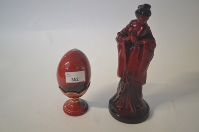 Lot 323 - A Royal Doulton flambe egg and holder number...