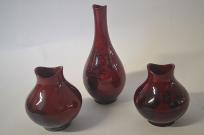 Lot 353 - Group of three Royal Doulton flambe vases, one...