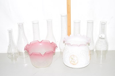 Lot 16 - Two glass light shades and a range of oil lamp...